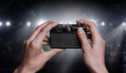 Old analog camera on male hands