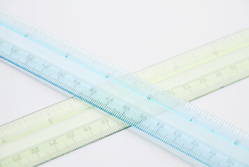 colorful plastic ruler crossing on white background