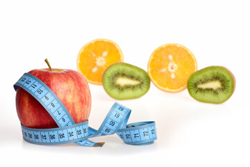 Tropical fruit: orange and kiwi fruit halves together with apple