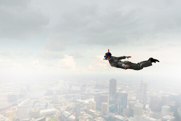 Businessman diving from top . Mixed media . Mixed media
