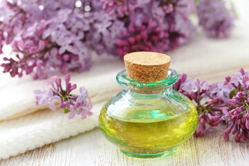 Fototapeta na wymiar Lilac essential aroma oil