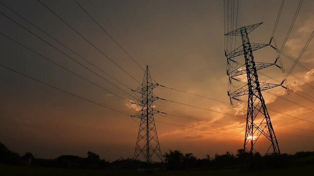 Electric pole, High voltage towers and sky sunset, day to night, Timelapse