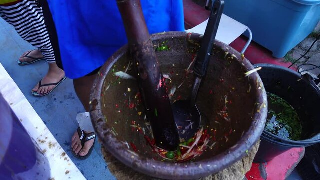 Thai people cooking green papaya salad or som tum at street food, Thailand 
