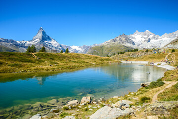 Naklejka na ściany i meble Lake Leisee with view to the Matterhorn mountain in beautiful landscape of the Alps at Zermatt, Switzerland