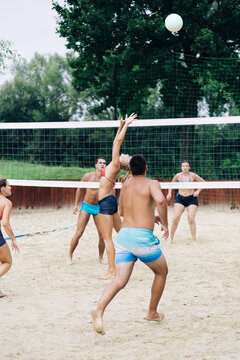 Beach volleyball, people outdoors. 