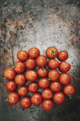 Fototapeta na wymiar Cherry Tomatoes on a Dark Background.