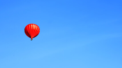 Red balloon on the beautiful blue sky.