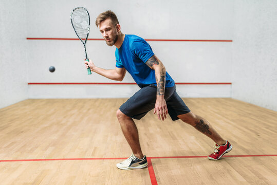 Squash game training, male player with racket