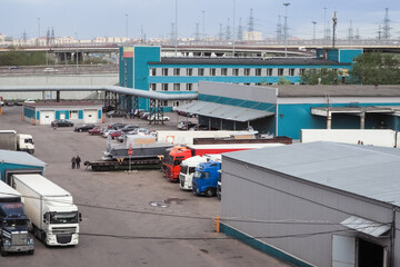 Heavy trucks loaded at the factory. Russia. Saint Petersburg, spring 2017. 