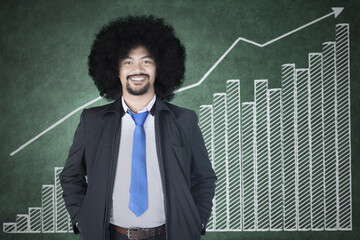 Afro businessman with financial graph