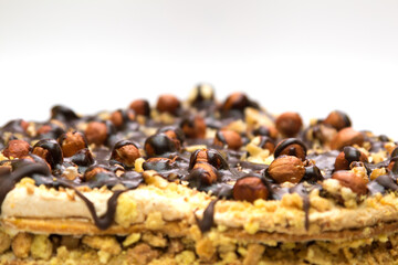 Cake with hazelnuts and chocolate in the form of heart