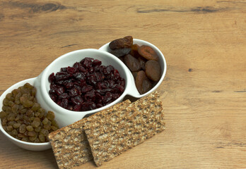 Three types of dried fruit and crisp bread
