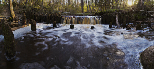 Waterfall on the ruins of an old mill.