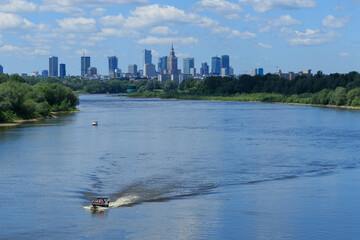 Warsaw skyline with skyscrapers and motorlboats on the Vistula river © irena iris szewczyk