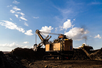 Part of a pit with big mining truck working