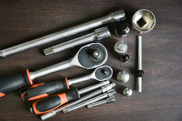 ratchet wrench lying on wooden table
