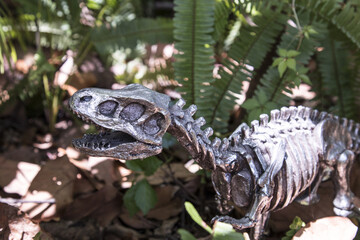 T-rex dinosaurs figurine in wild nature 