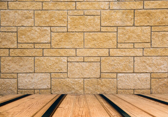 Empty wooden table on brick wall background beige color