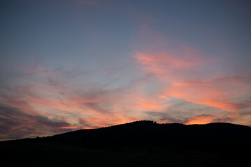 Sunset on meadow with hills and tree. Slovakia