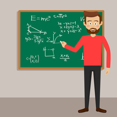 Male teacher in classroom next to blackboard with physical equations and formulas