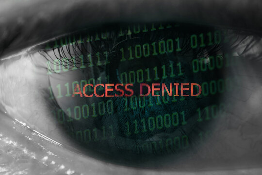 Access denied with binary code in an eye - Powered by Adobe