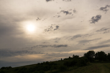 Sunset on meadow with hills and tree. Slovakia
