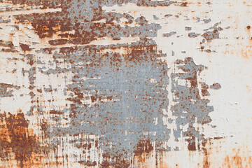 A background of peeling paint and rusty old metal