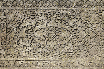 Arabian drawings and inscriptions are made on a very ancient stone