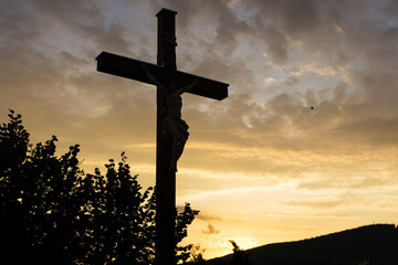 Cross with Christ during sunset. Slovakia