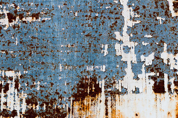 a background of peeling paint and rusty old metal