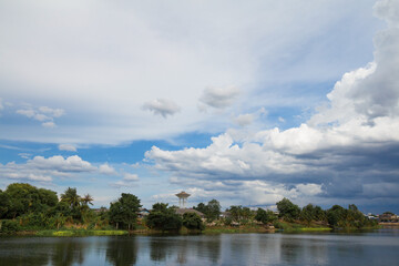 Panorama shot of peaceful riverside city landscape in country side.
