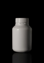 Vitamin plastic pill bottle medicine isolated on black