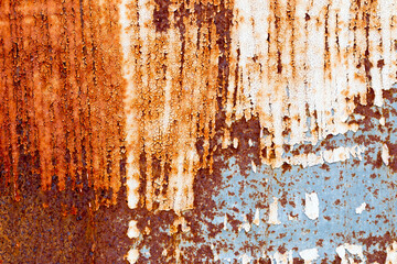 A background of peeling paint and rusty old metal