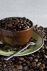 Cup of coffee bean on the stone table.