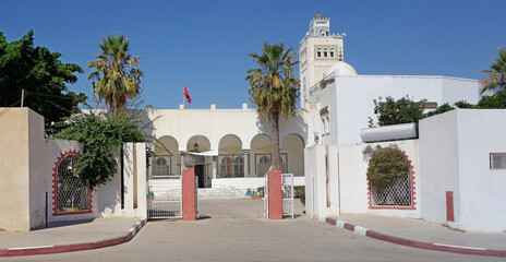 Fototapeta na wymiar A street in Tunis. White beautiful building.