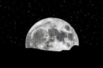 Full moon rising over the horizon stars