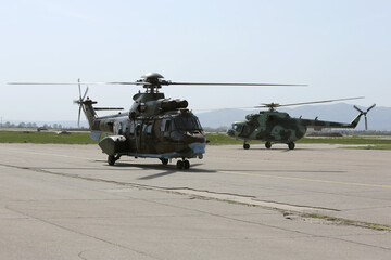 Fototapeta na wymiar Military helicopters at the airport