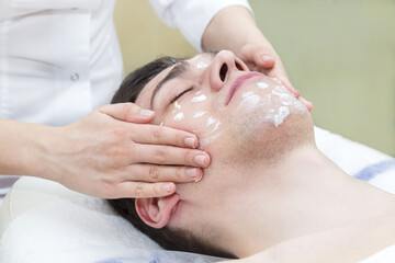 Man in the mask cosmetic procedure in spa salon 