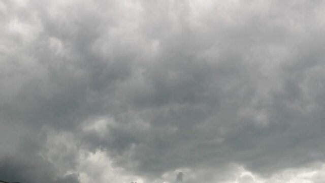 gray clouds run against the spring sky before thunderstorm