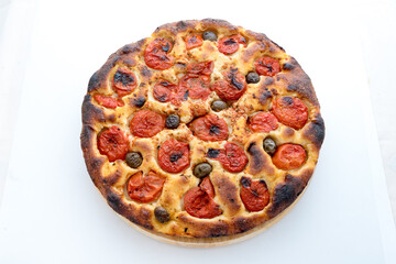 Focaccia typical of Bari Italy with tomatoes and olive