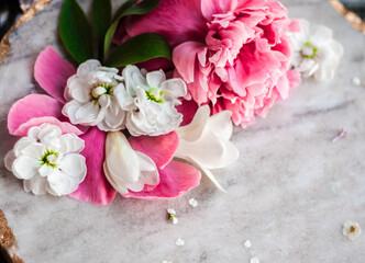 Gorgeous pink peonies on marble stone background