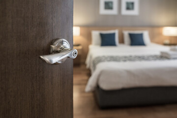 Digital Door handle , door open in front of blur interior room background, selective focus