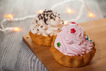A small cake on a wooden table.