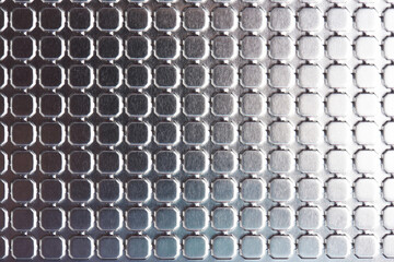 Squares on shiny metal surface