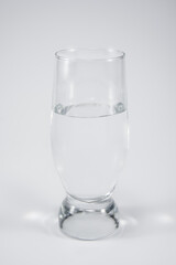 Glass with water isolated on a white background.