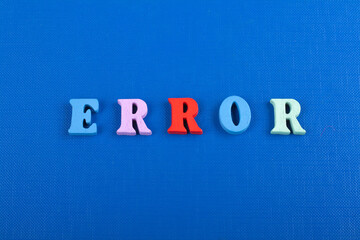 ERROR word on blue background composed from colorful abc alphabet block wooden letters, copy space for ad text. Learning english concept.