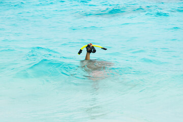 Hand with a mask for snorkeling