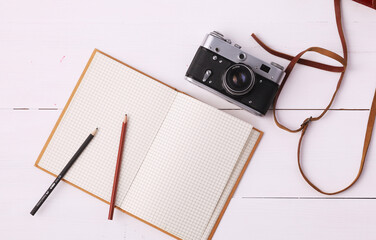 Fototapeta premium Flat lay woman clothing and accessories placed on a wooden background