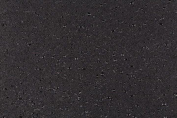 Water drops on dark stone