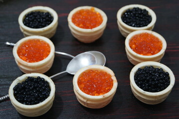 Black and red caviar for guests and friends.